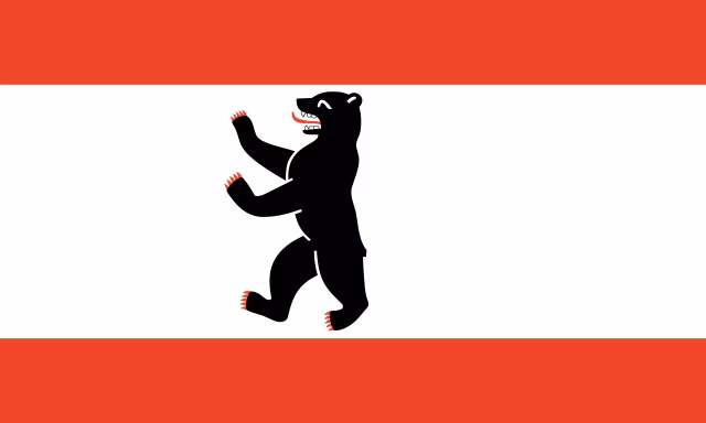 Die Fahne von Berlin zeigt einen schwarzen B&auml;ren vor weissem Hintergrund mit je einem roten Streifen oben und unten. Wikimedia Commons